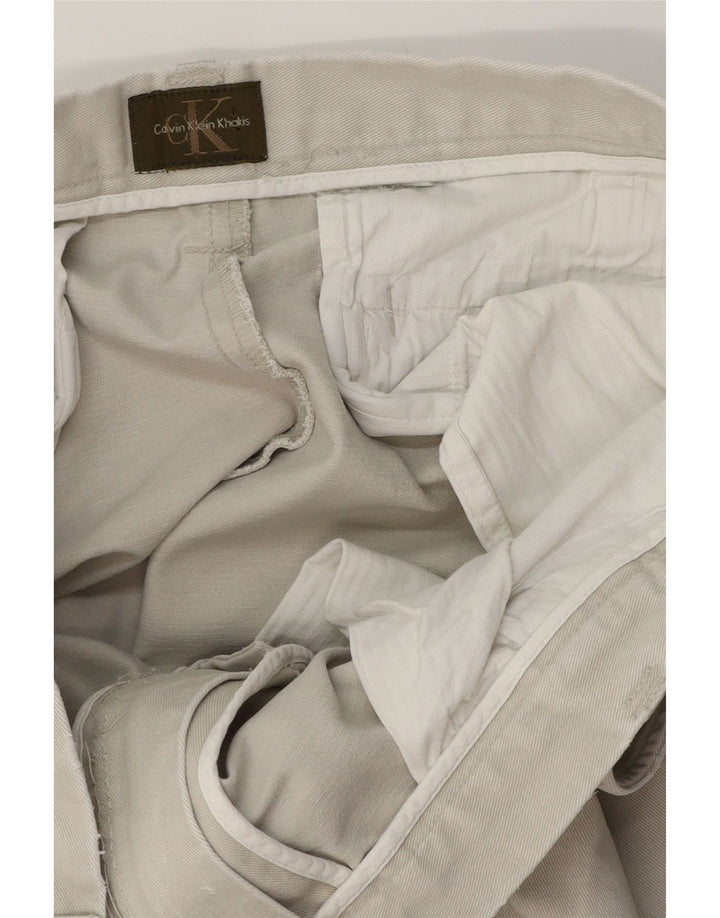 Pantaloni chino bootcut da uomo Calvin Klein W34 L32 Beige