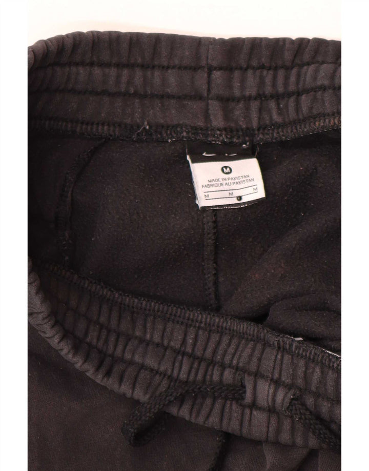 Pantaloni da tuta grafica Nike da uomo di colore nero medio