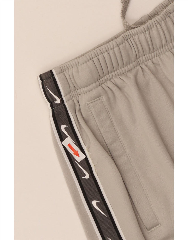 Pantaloni da tuta Nike da ragazzo Dri Fit Joggers 13-14 anni XL Grigio