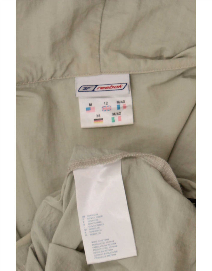 Giacca antipioggia con cappuccio Reebok da donna UK 12 nylon beige medio