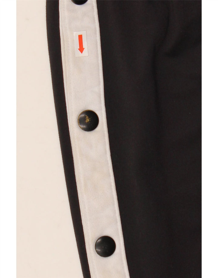 Pantaloni da tuta Nike da uomo in poliestere color block medio nero