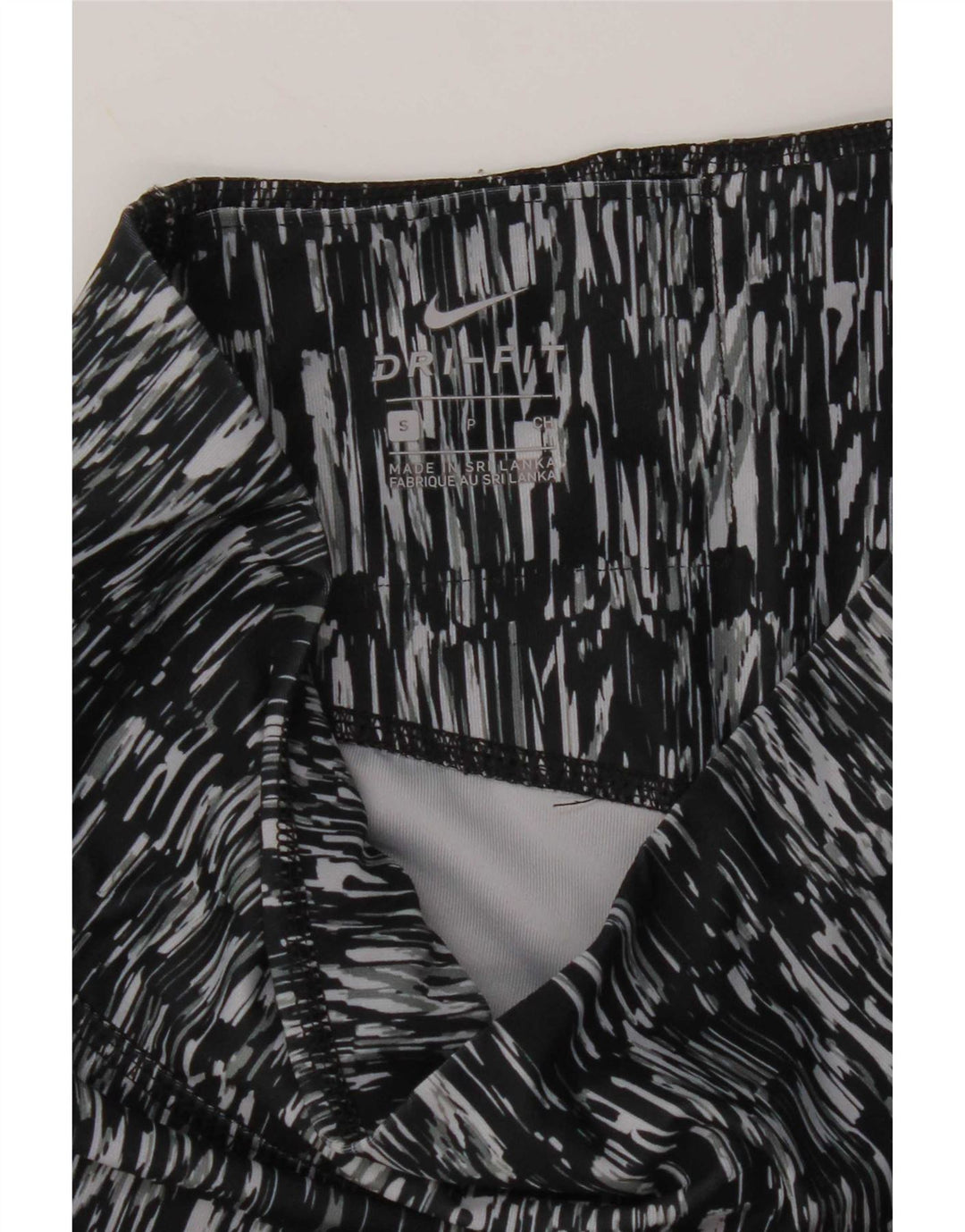 Leggings Capri da donna Dri Fit modello astratto Nike UK 10 piccoli neri