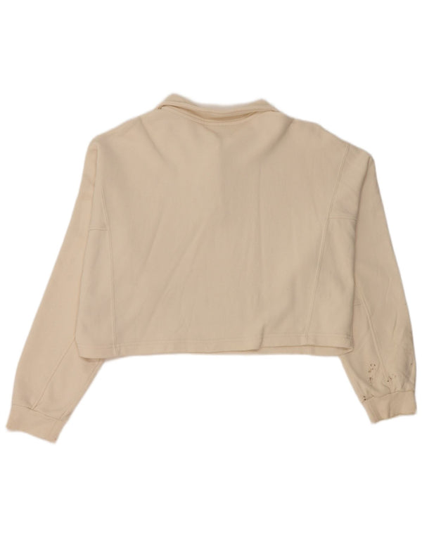 Polo da donna a maniche lunghe corta oversize da donna Puma UK 10 piccola in cotone beige