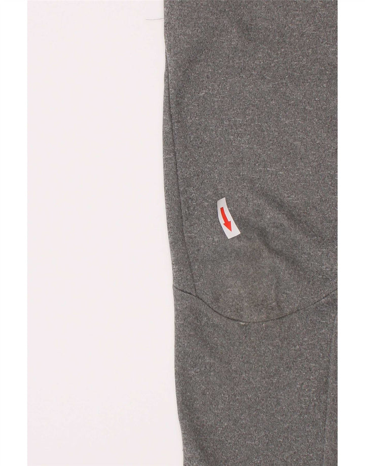 Pantaloni da tuta Nike da ragazzo Dri Fit Joggers 5-6 anni Grigio medio chiazzato
