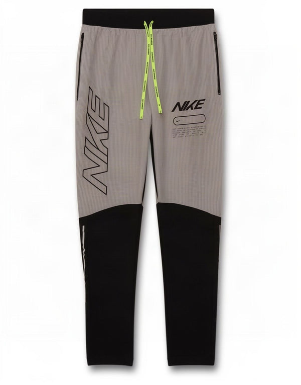Pantaloni da tuta grafica Nike Dri Fit da uomo Small Grey Colourblock