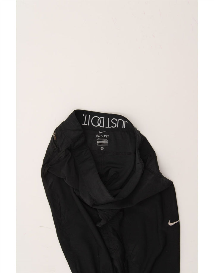 NIKE Womens Dri Fit Tracksuit Trousers UK 12 Medium Black Polyester Vintage Nike and Second-Hand Nike from Messina Hembry 