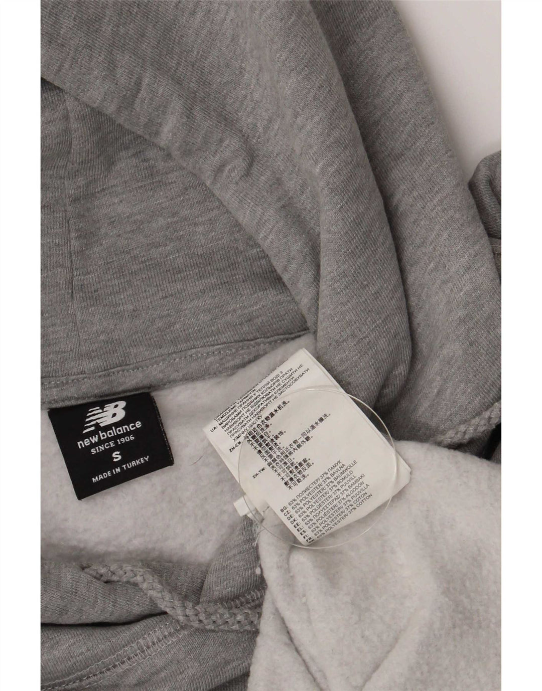 Maglione con cappuccio grafico da uomo New Balance piccolo poliestere grigio