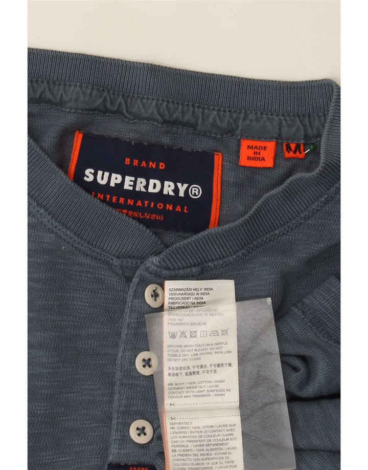 Top da uomo Superdry a maniche lunghe in cotone screziato blu medio