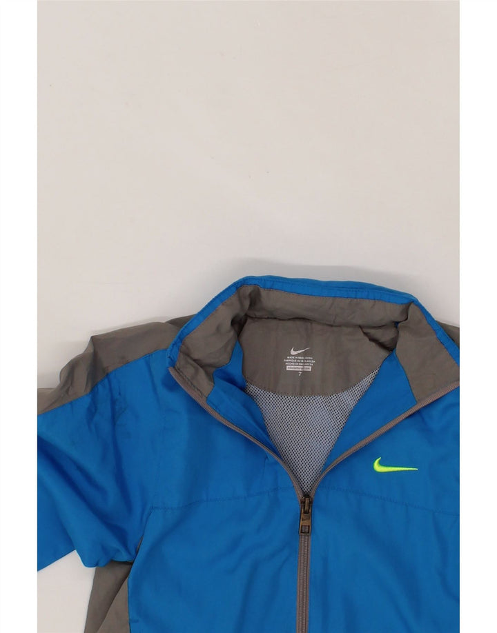 NIKE Boys Hooded Tracksuit Top Jacket 6-7 Years Blue Colourblock Polyester Vintage Nike and Second-Hand Nike from Messina Hembry 