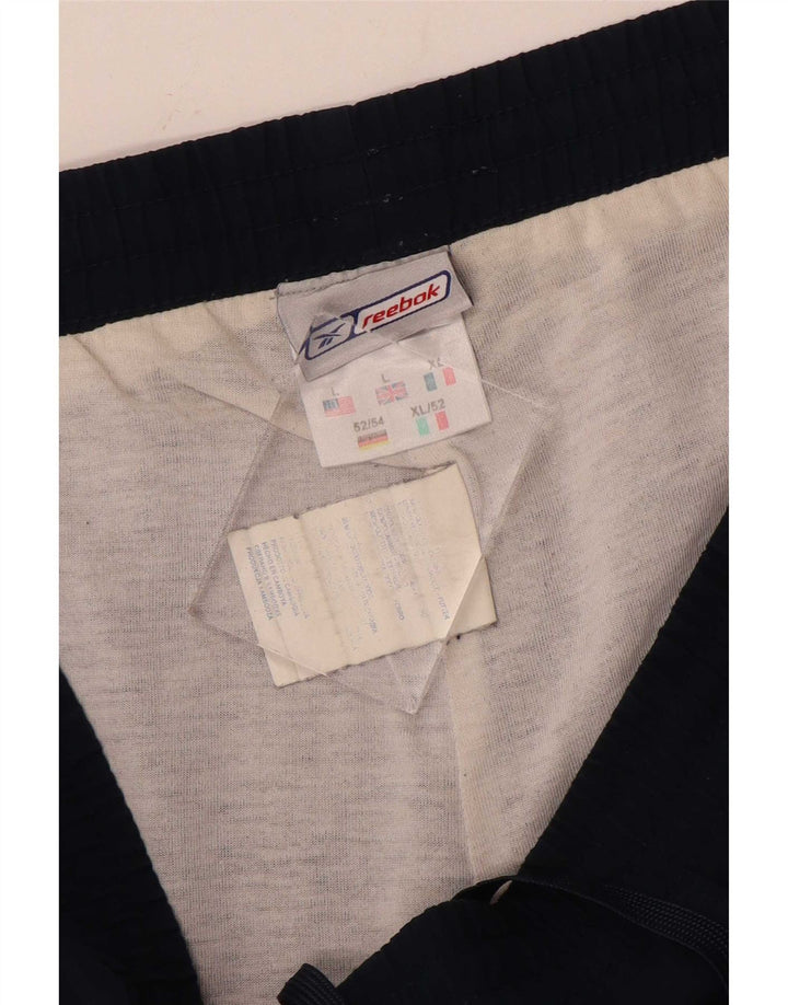 Pantaloni da tuta da uomo Reebok Joggers Large Blu Navy Poliammide