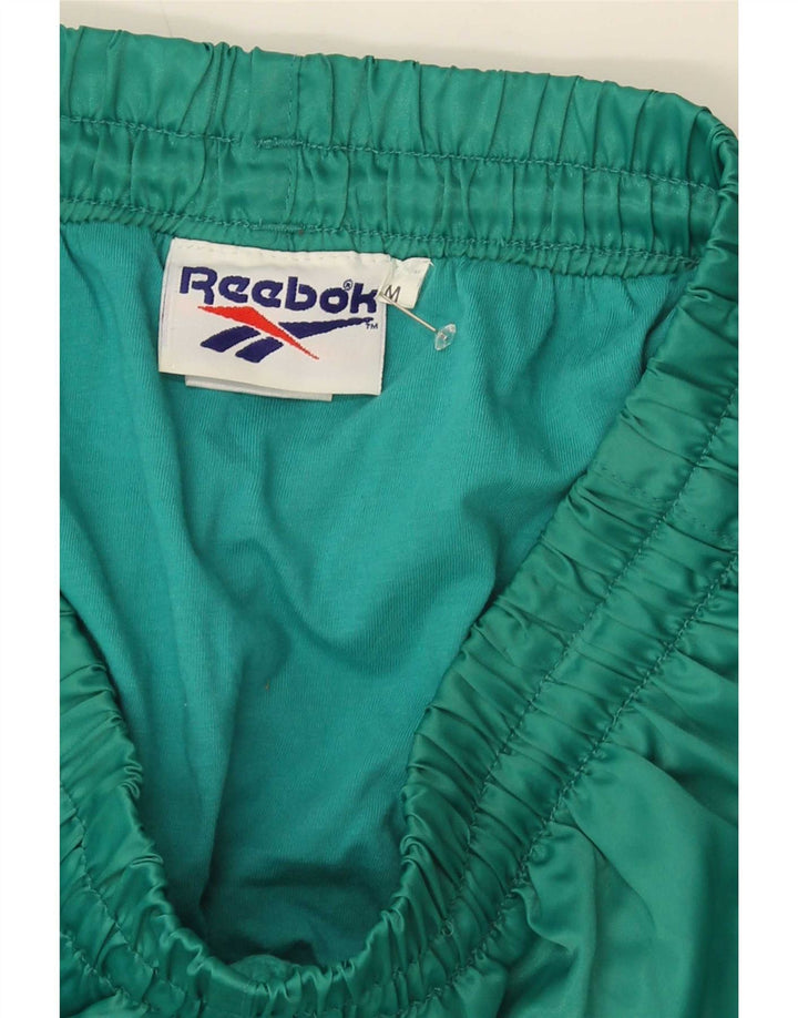 Pantaloncini sportivi Reebok da uomo in nylon verde medio