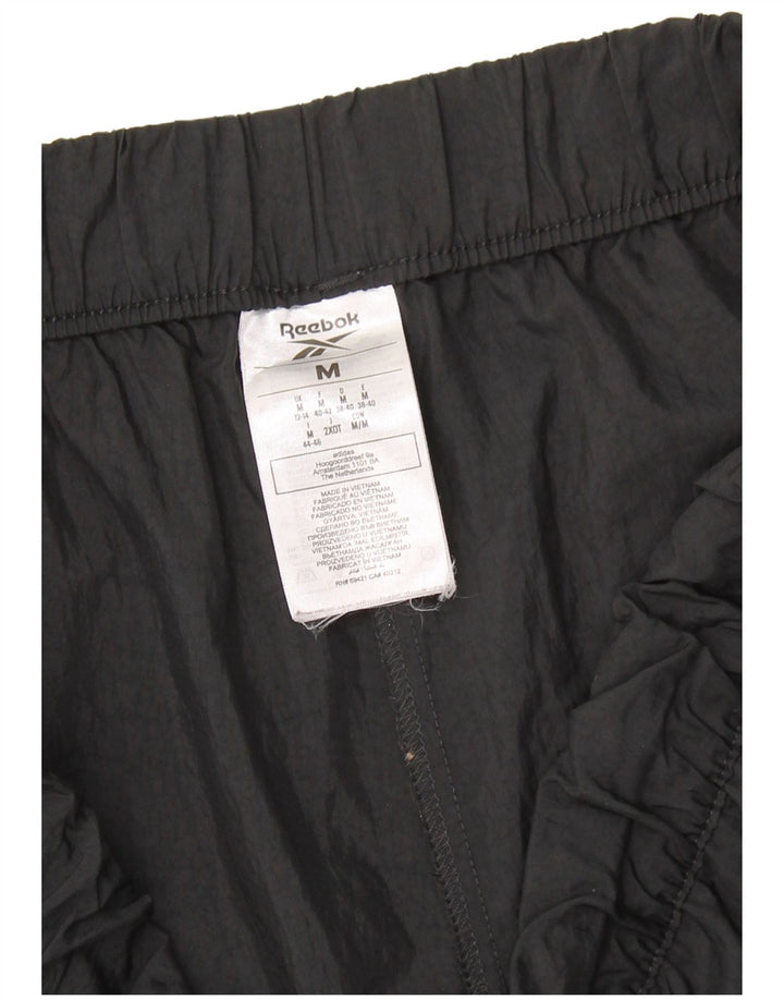 Pantaloni da tuta da donna REEBOK Joggers UK 12/14 Nylon nero medio