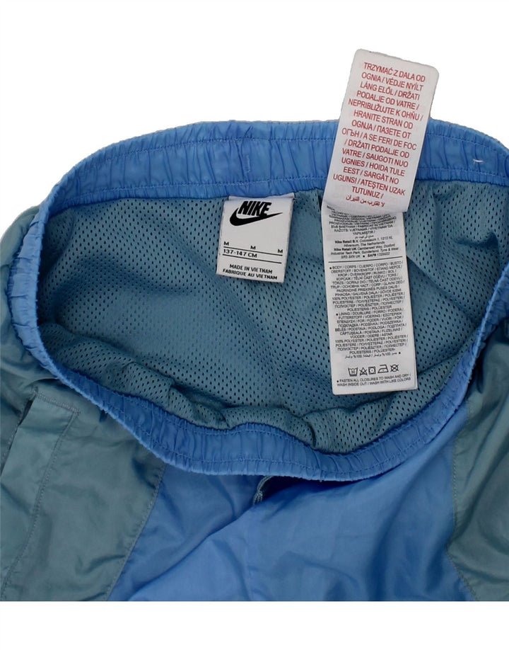 NIKE Boys Graphic Sport Shorts 10-11 Years Medium Blue Colourblock Vintage Nike and Second-Hand Nike from Messina Hembry 