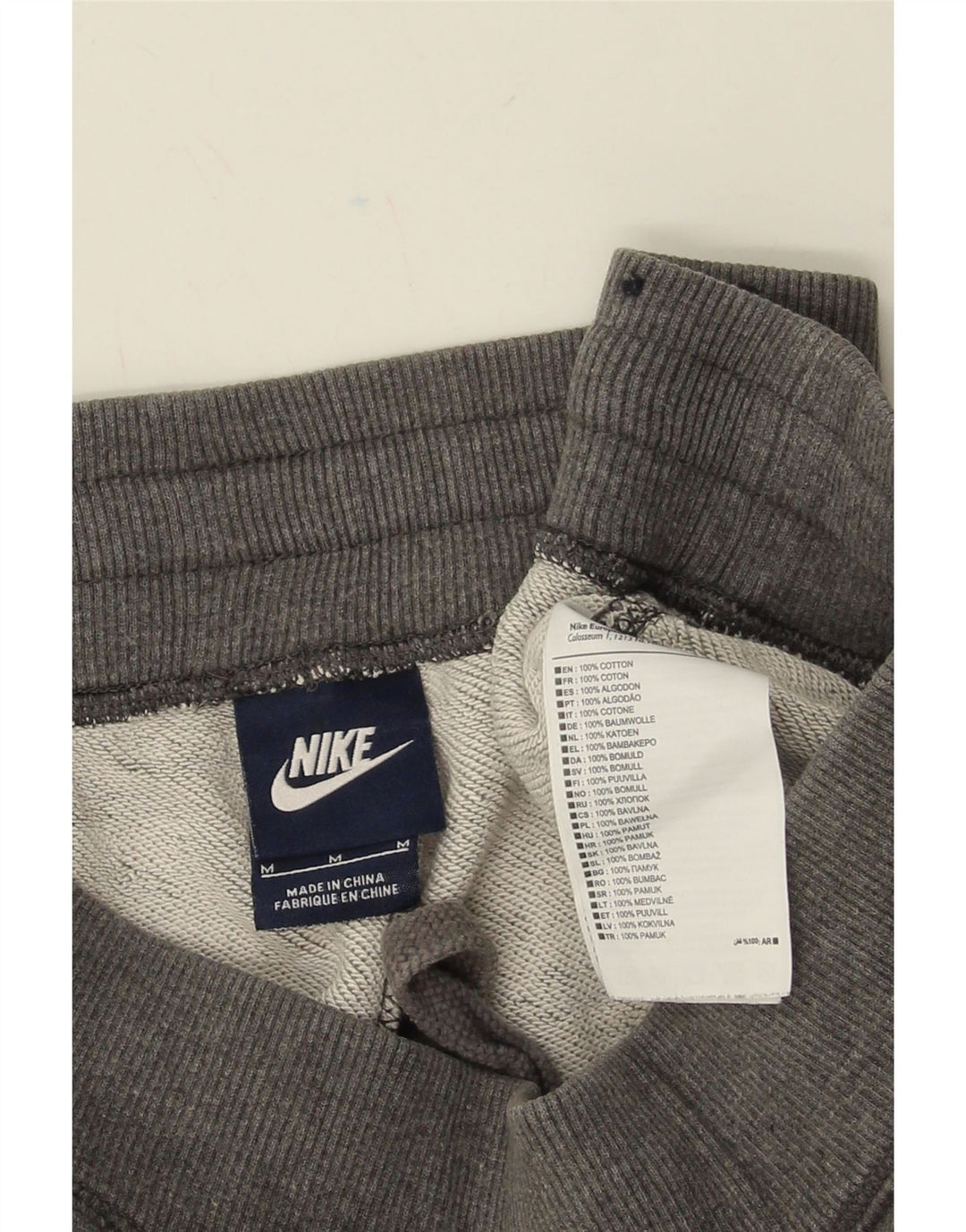 NIKE Mens Tracksuit Trousers Joggers Medium Grey Cotton Vintage Nike and Second-Hand Nike from Messina Hembry 