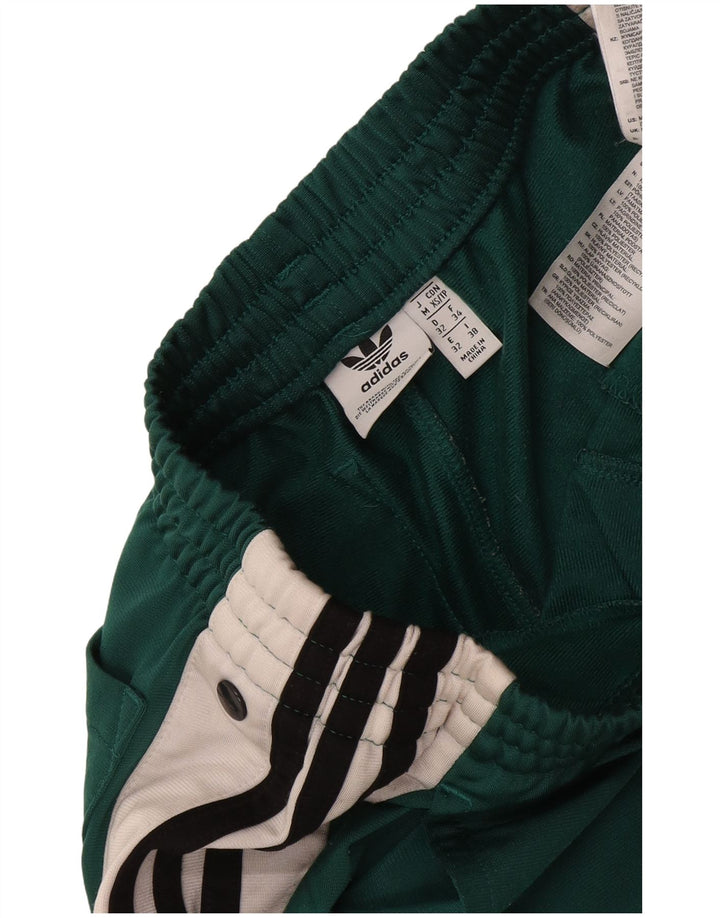 Pantaloncini sportivi Adidas da donna con grafica grafica, poliestere color block verde medio