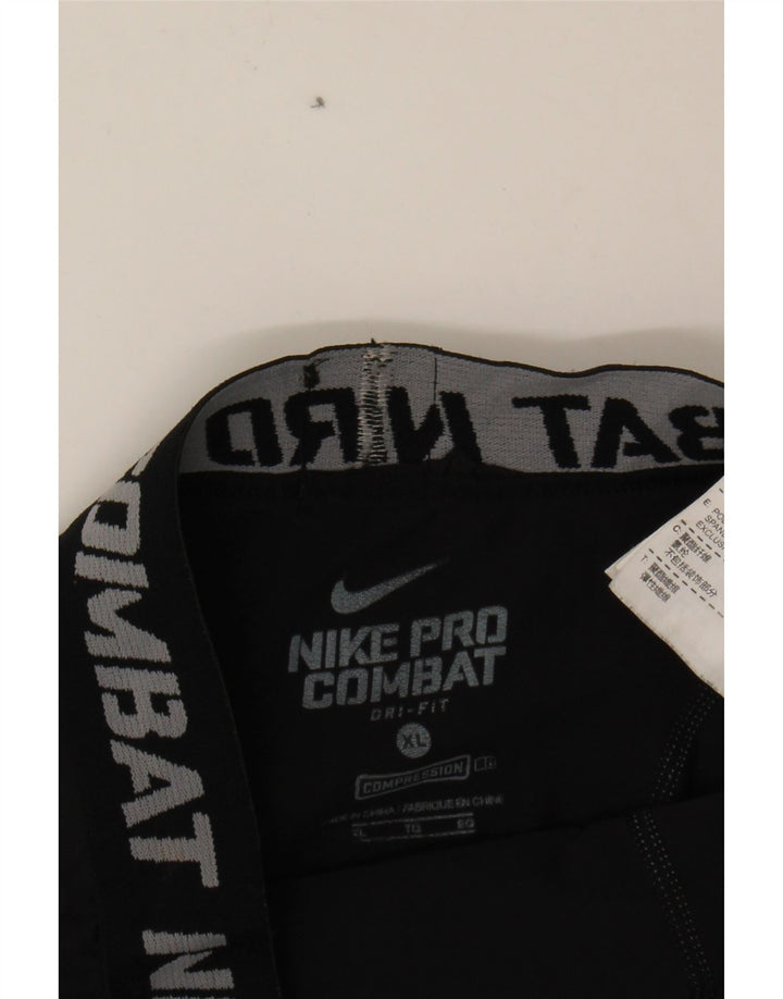 NIKE Boys Dri Fit Graphic Leggings 13-14 Years XL Black Polyester Vintage Nike and Second-Hand Nike from Messina Hembry 