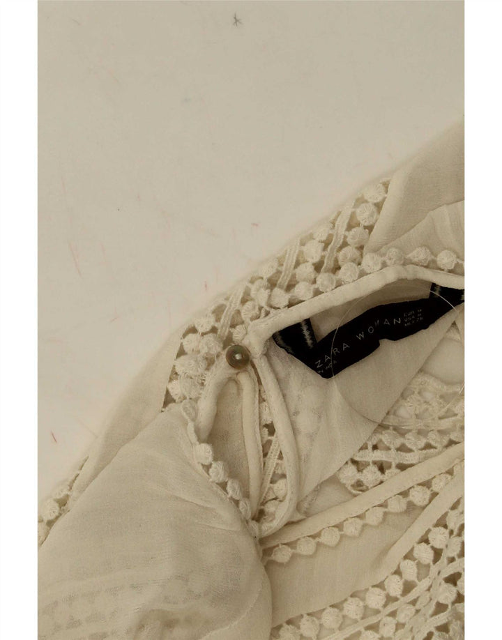 Top corto in camicetta di pizzo senza maniche da donna Zara UK 12 poliestere bianco medio