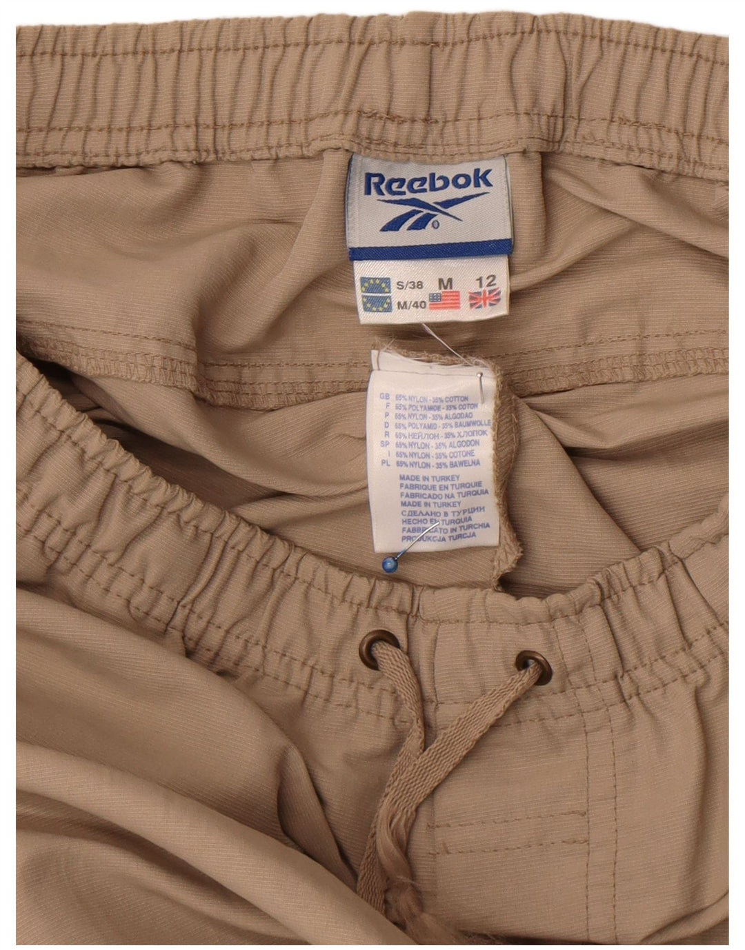Pantaloni da tuta Reebok da donna UK 12 Nylon beige medio
