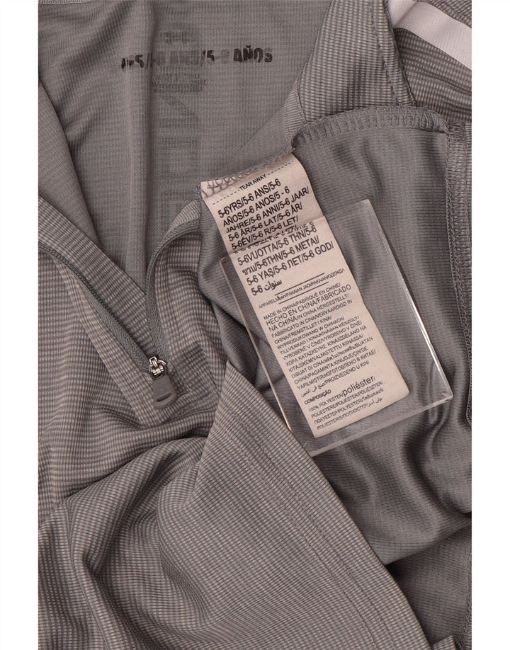 Top della tuta da ginnastica con grafica per ragazzi Under Armour 5-6 anni a righe grigie