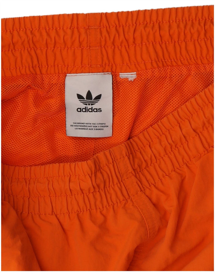 Pantaloncini sportivi Adidas da uomo di colore arancione medio