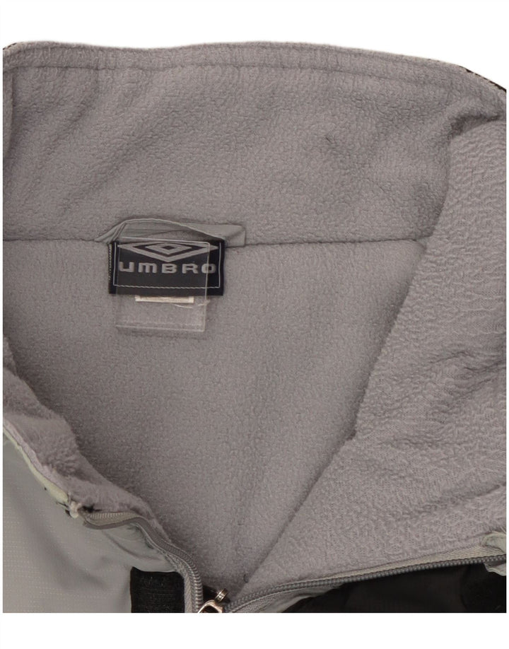 Giacca a vento da uomo Umbro UK 42 XL Nylon color block grigio