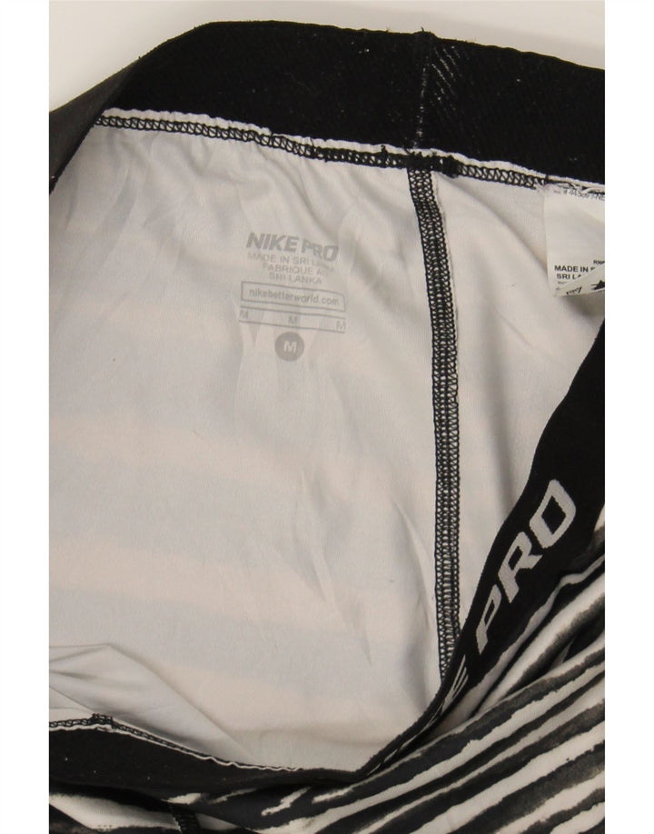 NIKE Womens Capri Leggings UK 12 Medium  Black Animal Print Polyester Vintage Nike and Second-Hand Nike from Messina Hembry 