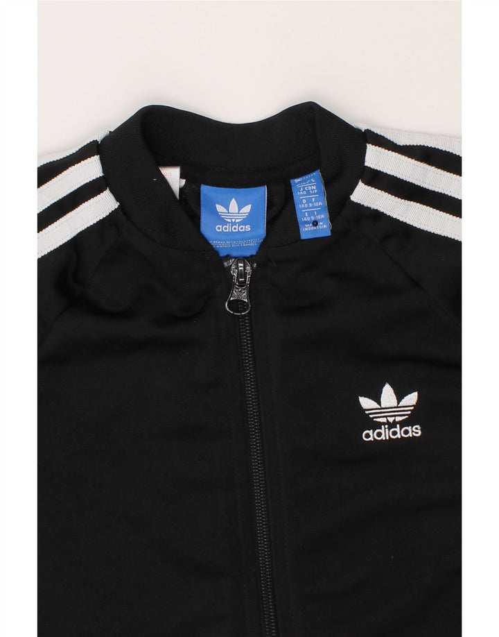ADIDAS Girls Graphic Tracksuit Top Jacket 9-10 Years Black Polyester Vintage Adidas and Second-Hand Adidas from Messina Hembry 