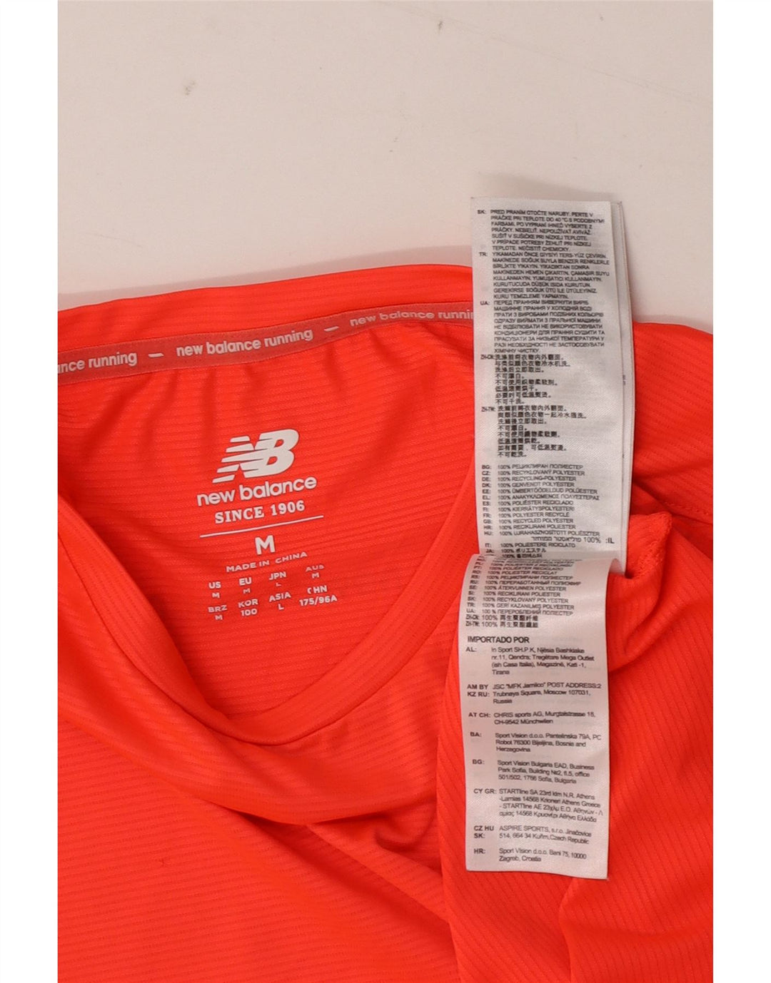 T-shirt da uomo New Balance Top in poliestere arancione medio