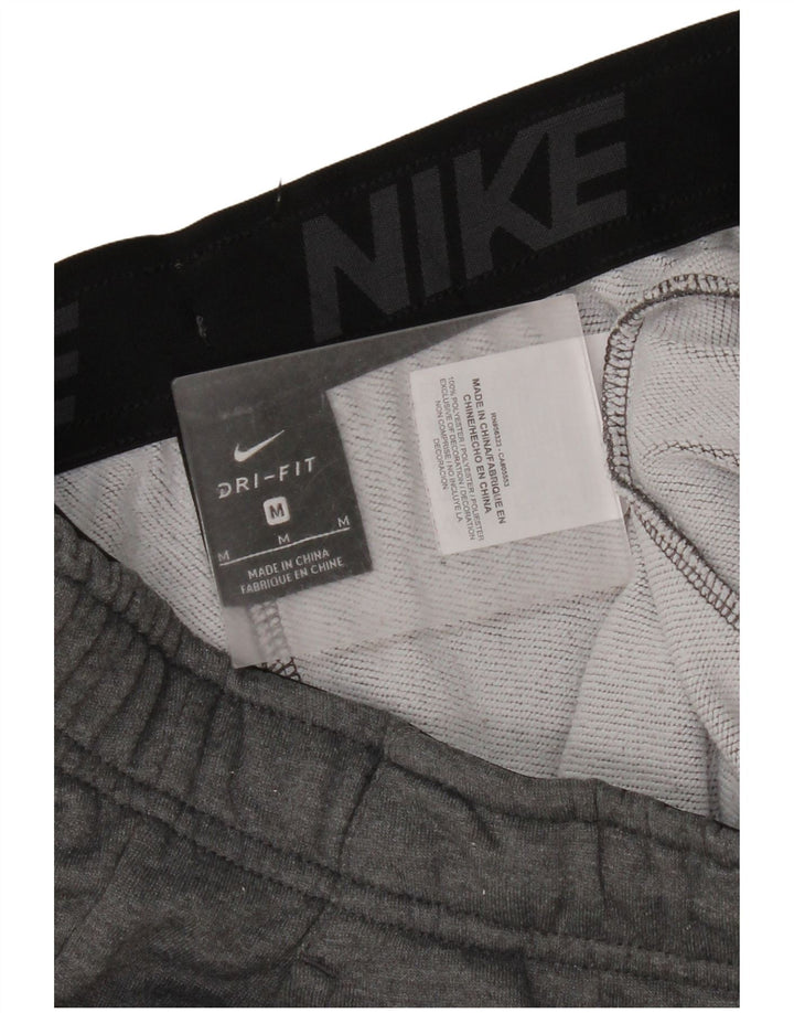 Pantaloni da tuta Nike Dri Fit da donna UK 14 Poliestere grigio medio