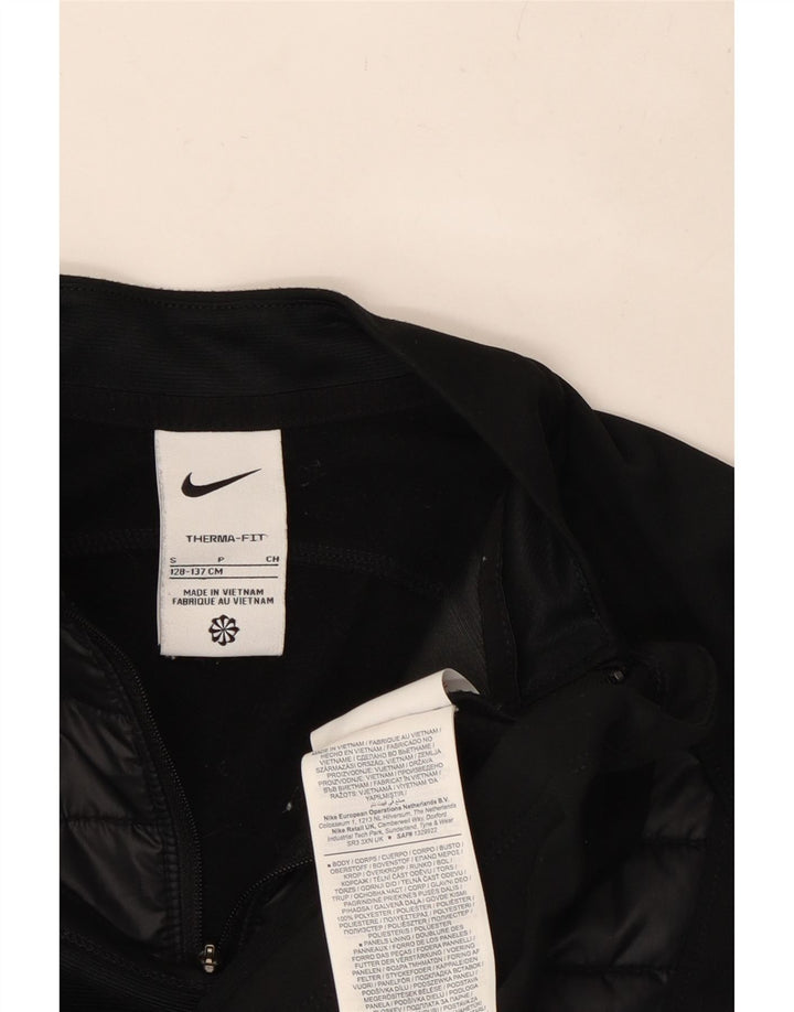 NIKE Boys Therma-Fit Zip Neck Pullover Tracksuit Top 8-9 Years Small Black Vintage Nike and Second-Hand Nike from Messina Hembry 