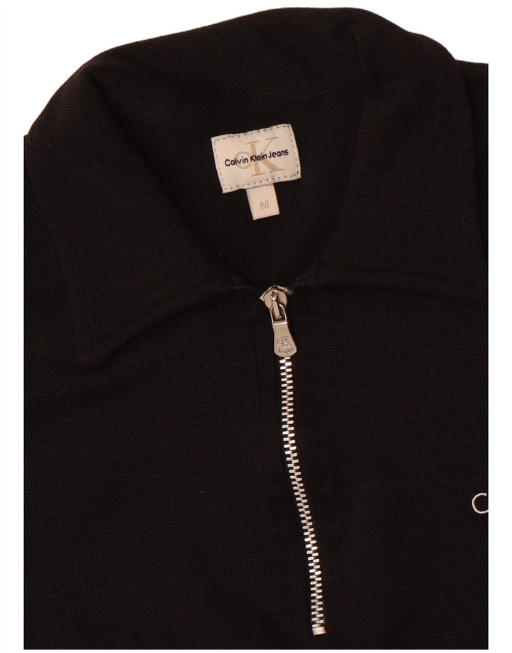 Polo corta da donna Calvin Klein Jeans UK 12 media nera