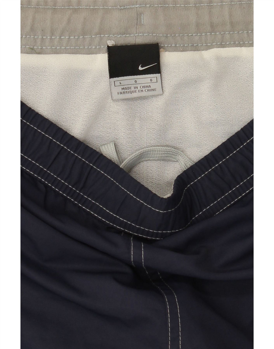 NIKE Boys Graphic Sport Shorts 12-13 Years Large Navy Blue Vintage Nike and Second-Hand Nike from Messina Hembry 