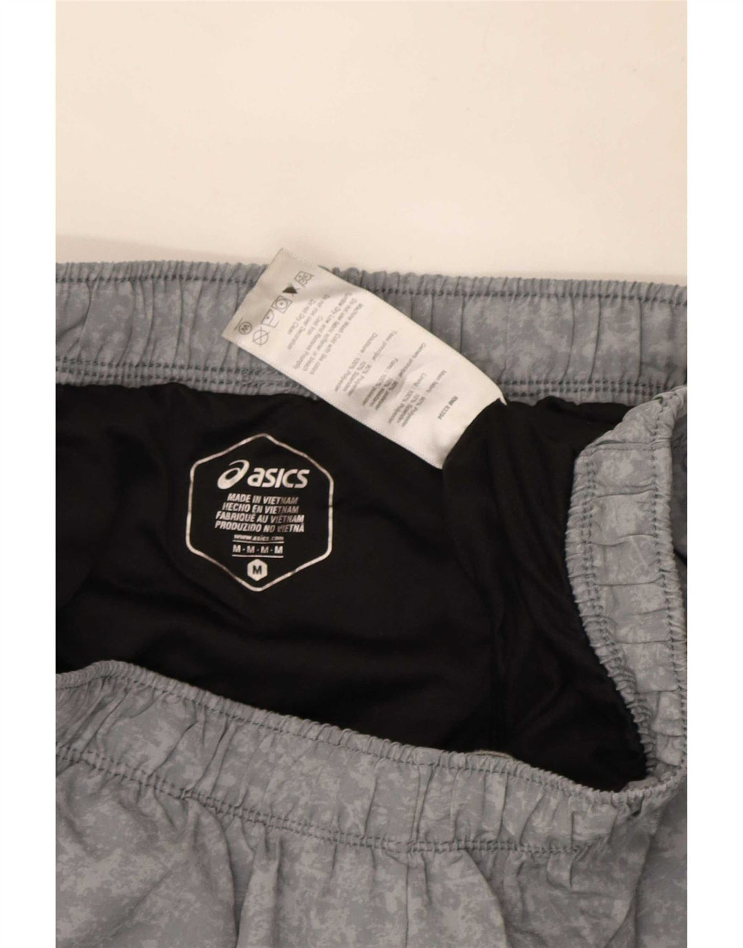Pantaloncini sportivi da uomo Asics in poliestere mimetico grigio medio