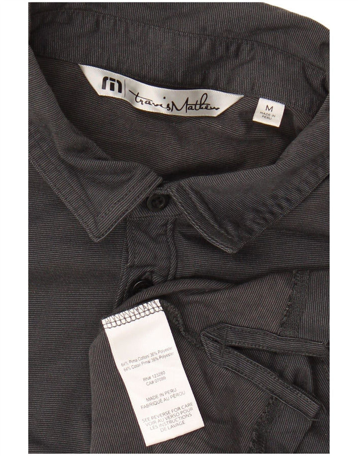 Polo da uomo TRAVIS MATHEW media cotone nero