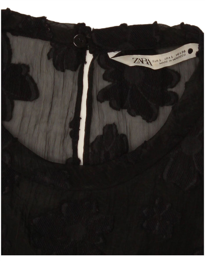 Top trasparente da donna Zara UK 16 grande nero floreale