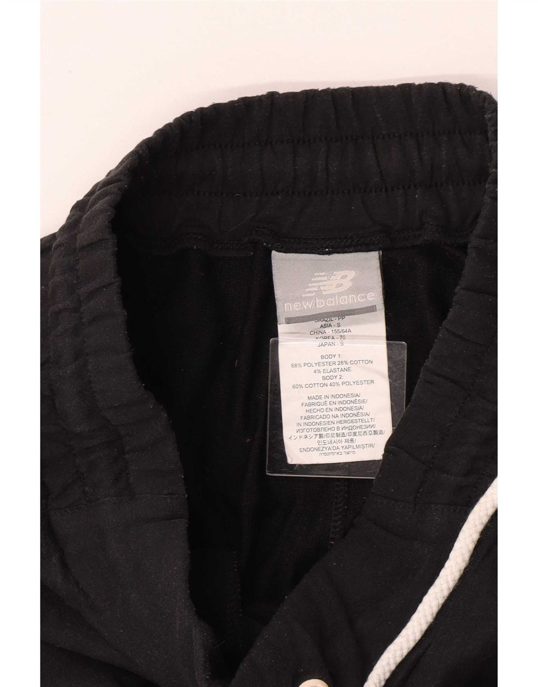 Pantaloni da tuta da donna New Balance UK 4 XS poliestere nero