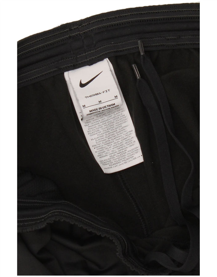Pantaloni da tuta Nike Therma-Fit da uomo in poliestere nero medio