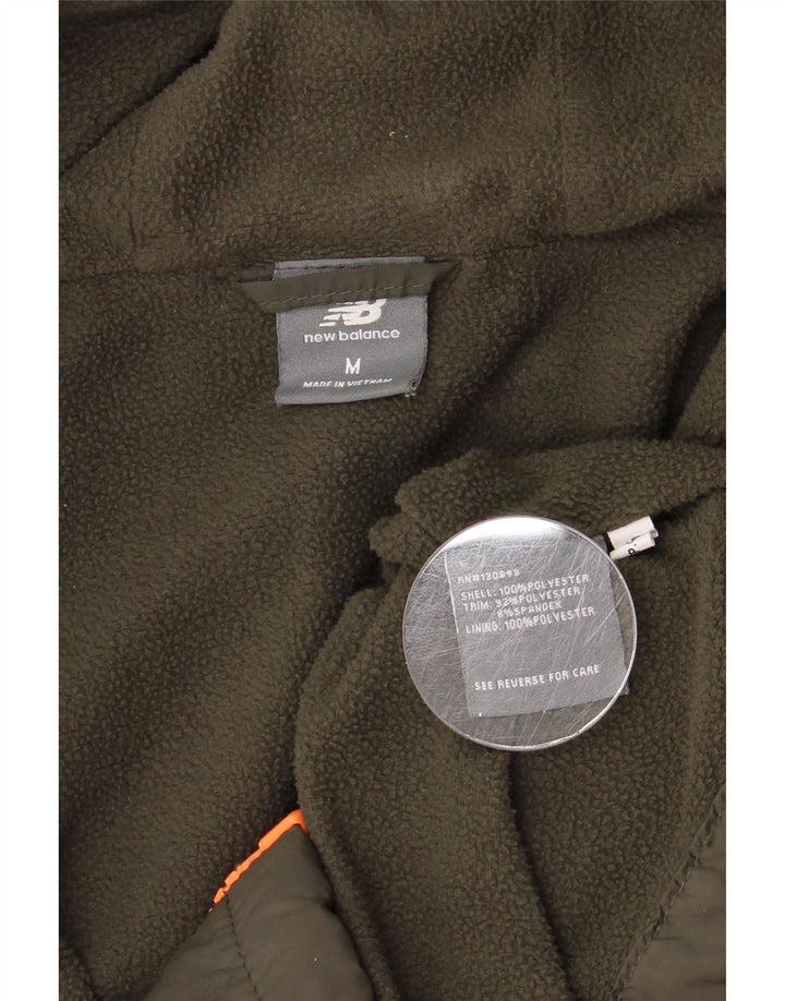 Giacca a vento con cappuccio da donna New Balance UK 14 poliestere kaki medio