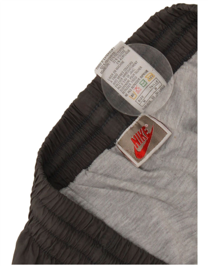 Pantaloni da tuta da uomo Nike Joggers in nylon grigio medio