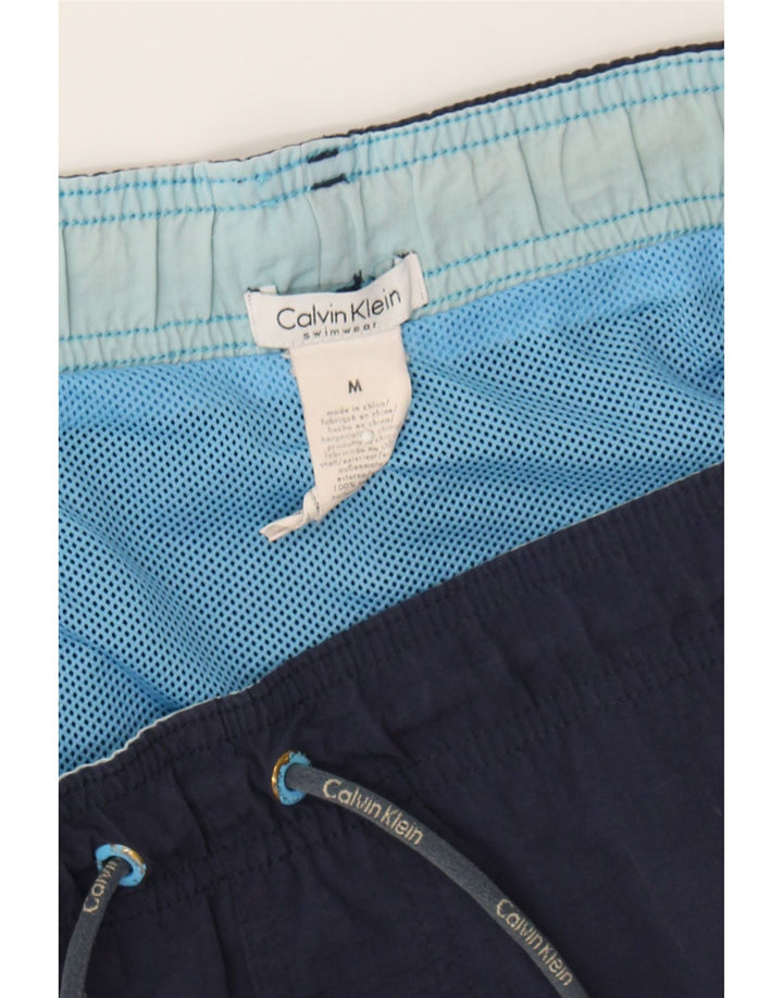 CALVIN KLEIN Mens Graphic Swimming Shorts Medium Navy Blue Nylon Vintage Calvin Klein and Second-Hand Calvin Klein from Messina Hembry 