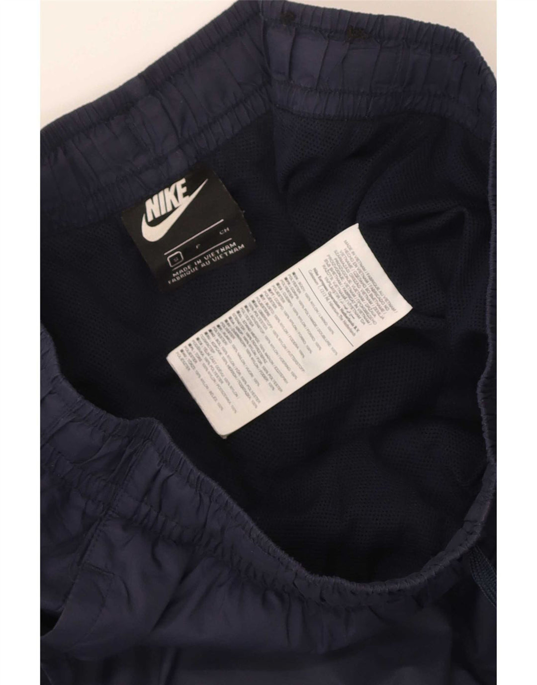 Pantaloni da tuta da uomo Nike Joggers piccoli in nylon blu navy