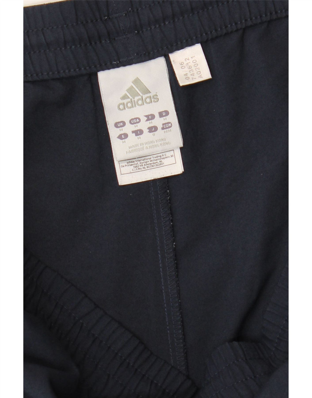 Pantaloni da tuta da uomo Adidas medi in poliestere blu navy
