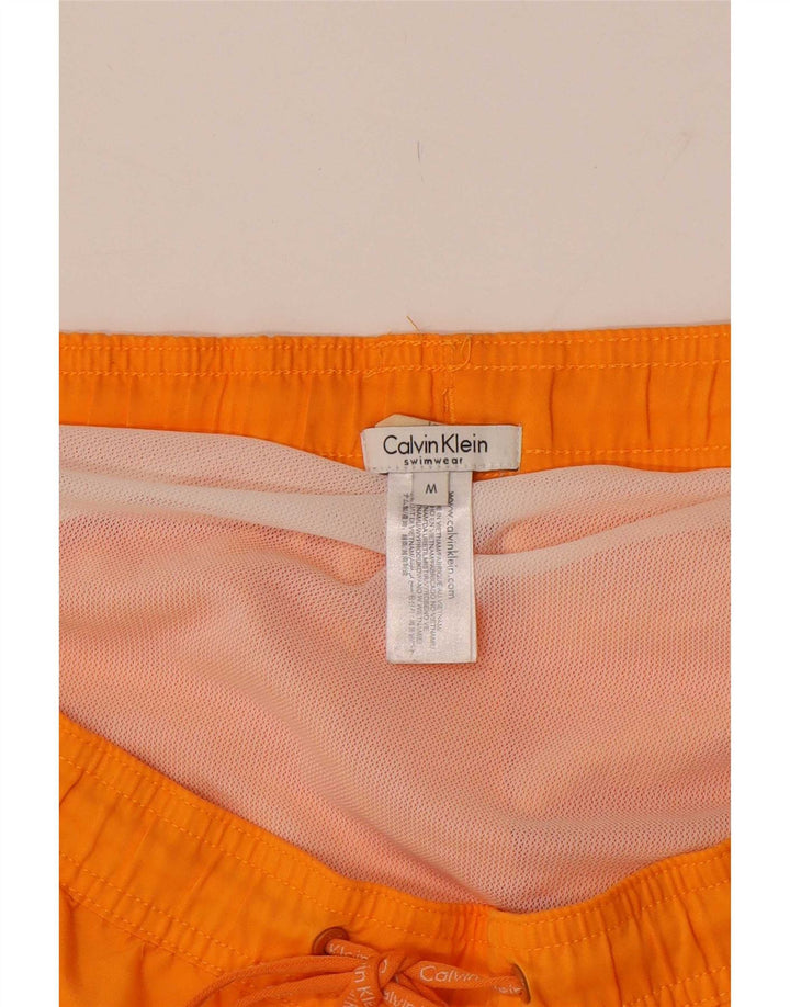 Pantaloncini da bagno con grafica da uomo Calvin Klein Medium Orange Colourblock
