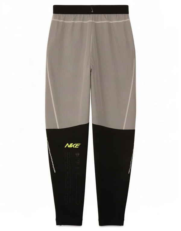Pantaloni da tuta grafica Nike Dri Fit da uomo Small Grey Colourblock