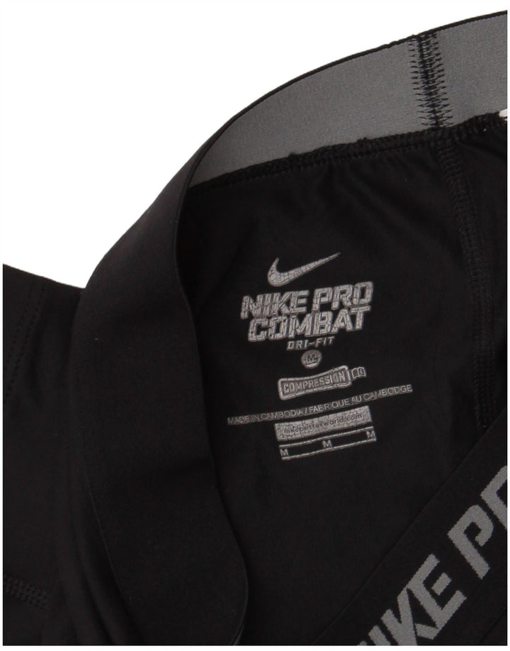Leggings Nike Dri Fit Graphic Capri da donna UK 12 medio nero