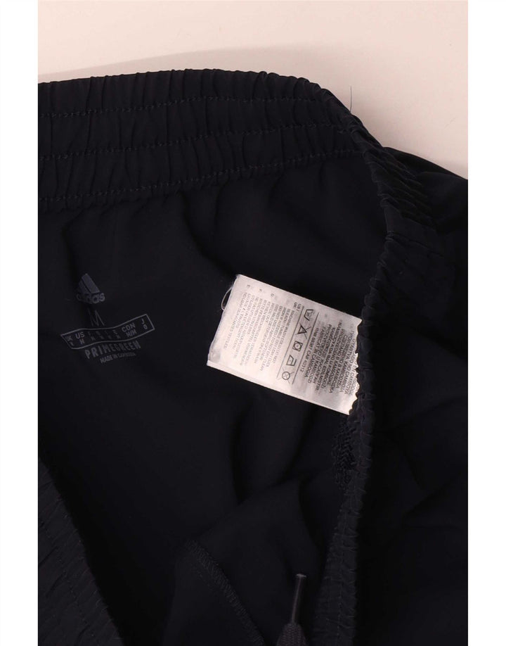 Pantaloni da tuta da uomo Adidas medi in poliestere blu navy