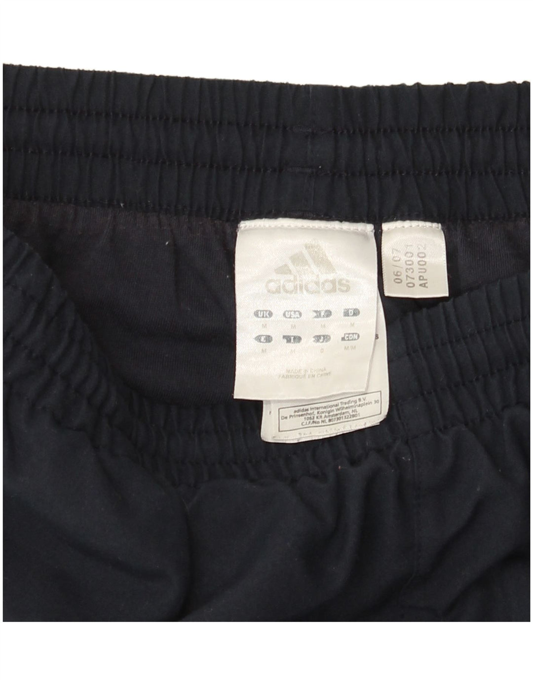 Pantaloni da tuta da uomo Adidas medi in poliestere blu navy