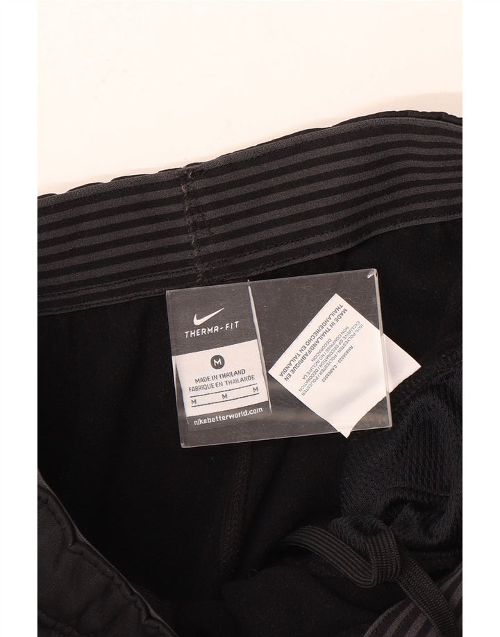 Pantaloni da tuta Nike Therma-Fit da uomo in poliestere nero medio