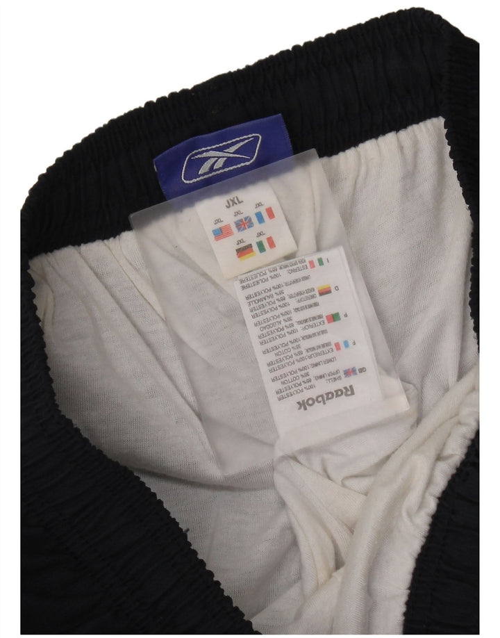 Pantaloni da tuta grafica Reebok da ragazzo 14-15 anni XL Blu navy Colourblock