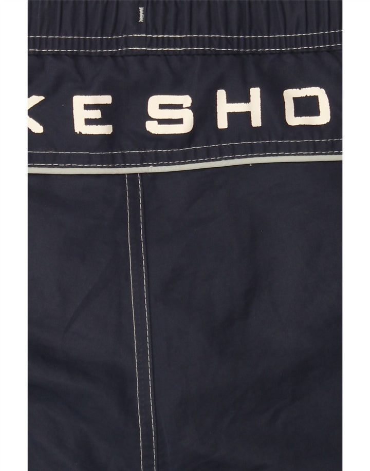 NIKE Boys Graphic Sport Shorts 12-13 Years Large Navy Blue Vintage Nike and Second-Hand Nike from Messina Hembry 